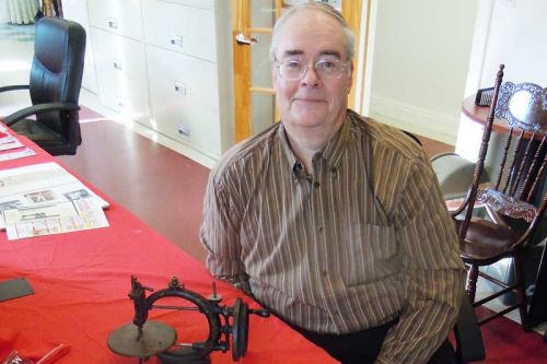 Eric Simkins, of Simkins Sewing Machines with the 1867 Abbott machine that his grandfather M.W. Simkins sold in 1867.